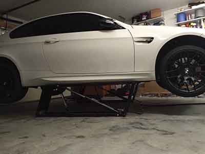 QuickJack Car Lift with Factory White Car